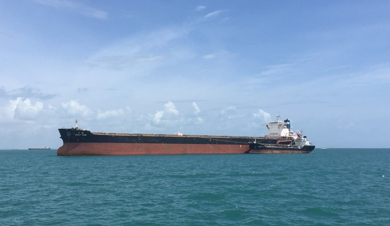 Capesize dry-bulk ship, the Great Tang, takes on bunker fuel in the Sing Straits