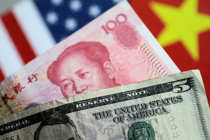 FILE PHOTO: Illustration photo of U.S. Dollar and China Yuan notes
