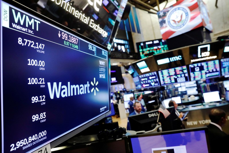 FILE PHOTO: A Walmart logo is displayed above the floor of the New York Stock Exchange shortly after the opening bell in New York