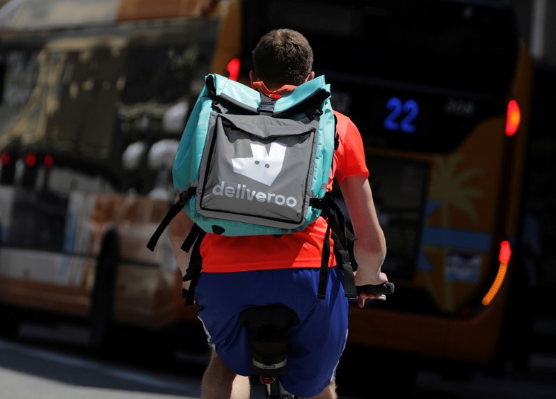 FILE PHOTO: A food delivery cyclist carries a Deliveroo bag in Nice