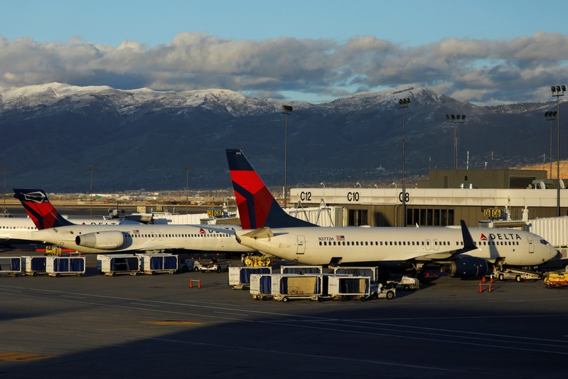 FILE PHOTO: Delta Air Lines planes are shown parked at their gates at the airport in Salt Lake City