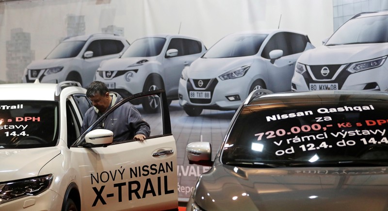 A visitor looks at a Nissan car during the Prague Autoshow in Prague
