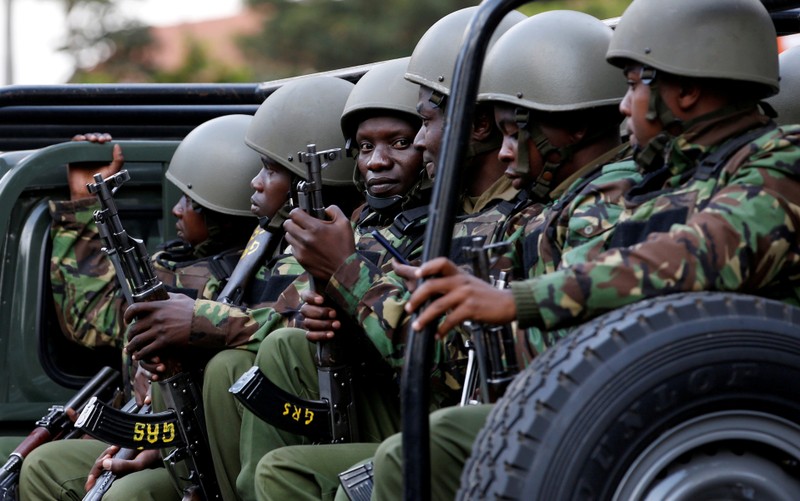 FILE PHOTO: Kenyan police officers drive in their truck as they arrive at the scene where explosions and gunshots were heard at the Dusit hotel compound, in Nairobi