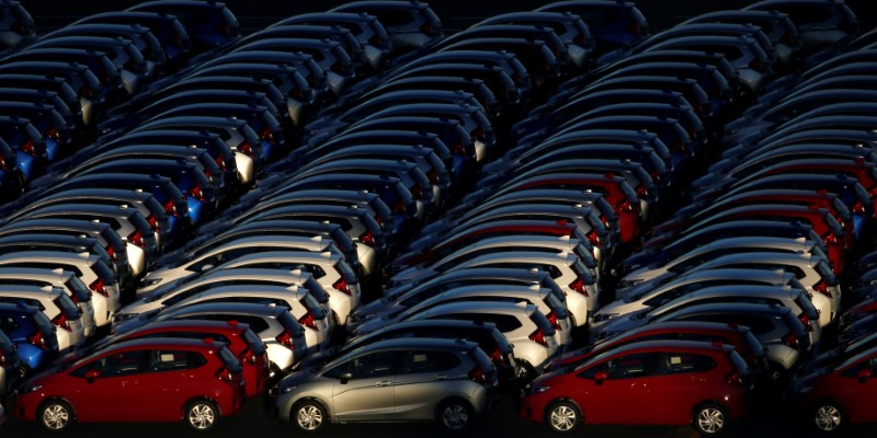 Newly manufactured cars await export at port in Yokohama