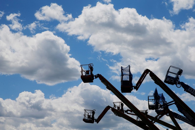 Construction lifts are parked near the Drydock Center in Boston
