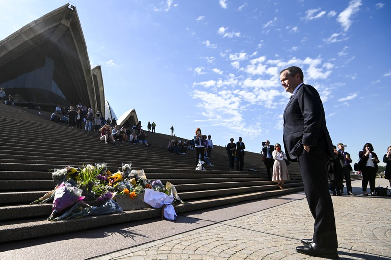 Australian Opposition Leader Bill Shorten is seen in front of the Opera House placing a floral tribute to the late former Australian Prime Minster Bob Hawke in Sydney