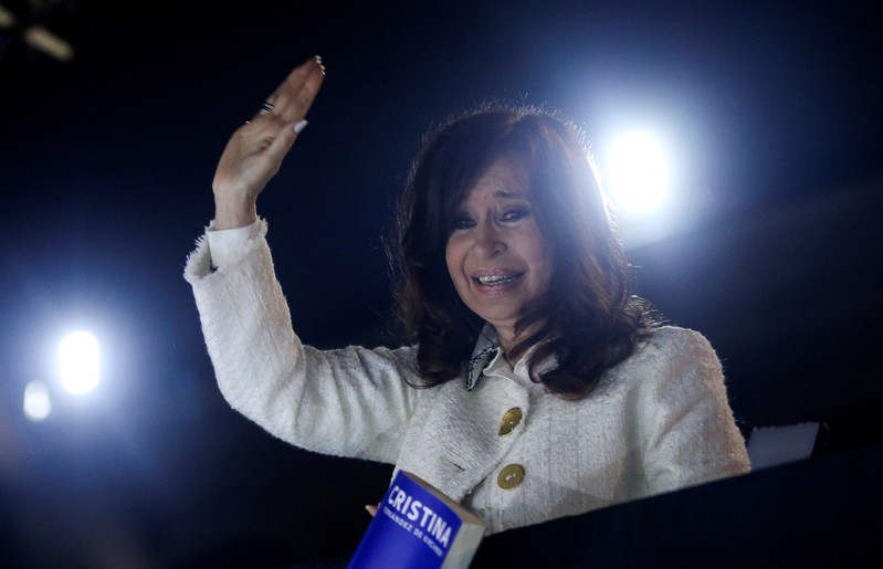 Argentina's former President Cristina Fernandez de Kirchner waves to supporters after the presentation of her book