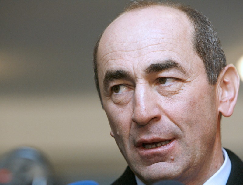 Armenia's President Kocharyan speaks to the media after casting his ballot at a polling station in Yerevan