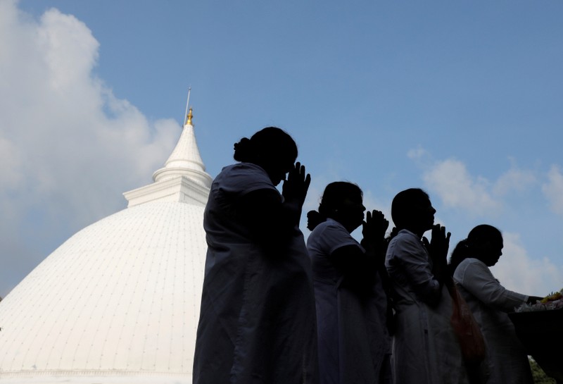 Buddhist devotees worship at the Kelaniya Buddhist temple during Vesak Day, commemorating the birth, enlightenment and death of Buddha, in Colombo