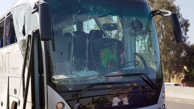 A damaged bus is seen at the site of a blast near a new museum being built close to the Giza pyramids in Cairo
