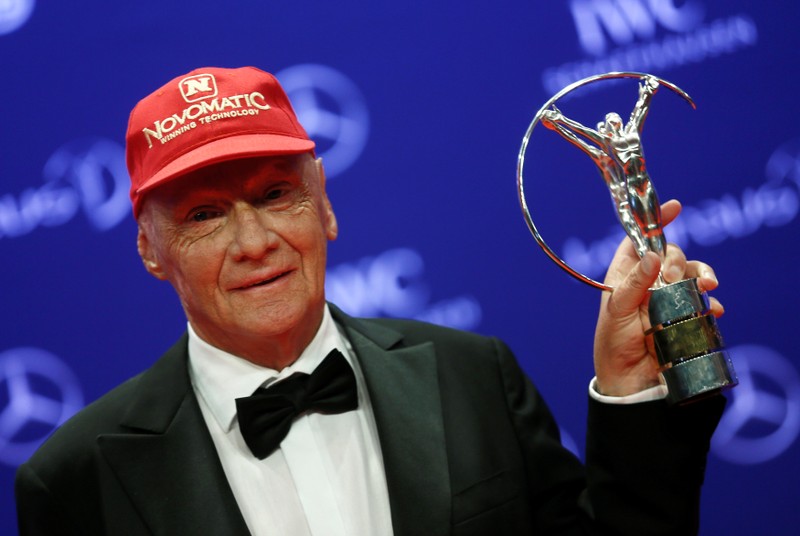 FILE PHOTO: Former Formula One driver Lauda poses with his Lifetime award during the Laureus World Sports Awards 2016 in Berlin
