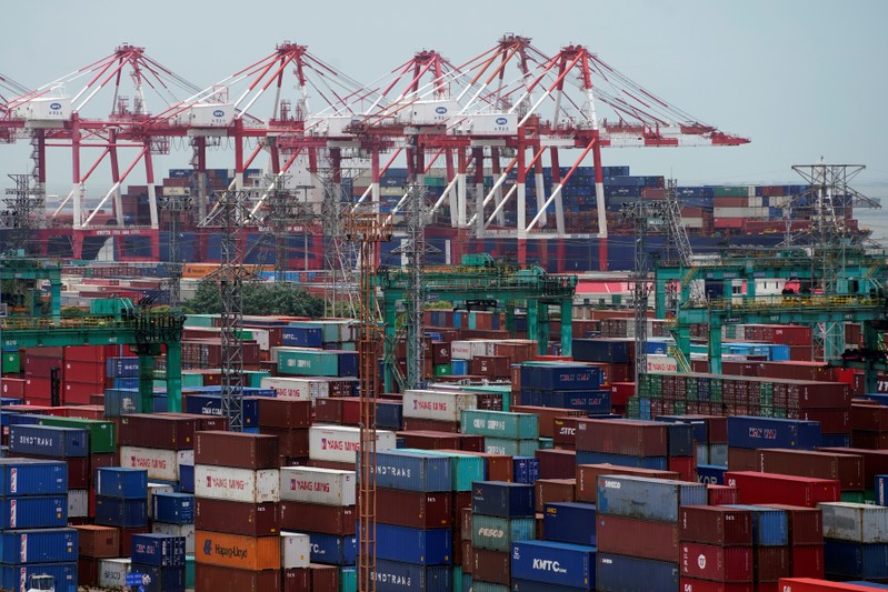 Shipping containers are seen at a port in Shanghai