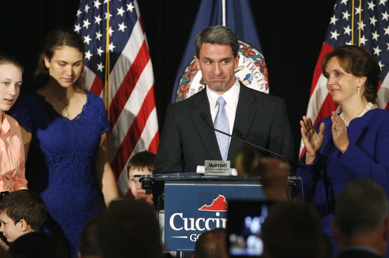 Cuccinelli stands onstage with his wife and their family as he gives his concession speech at his election night event in Richmond, Virginia
