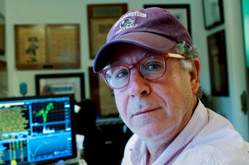 FILE PHOTO: Doug Kass, founder of hedge fund Seabreeze Partners Management Inc, sits at his desk at his home in Palm Beach