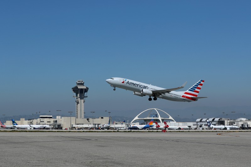 FILE PHOTO: An American Airlines Boeing 737 plane takes off from Los Angeles International airport