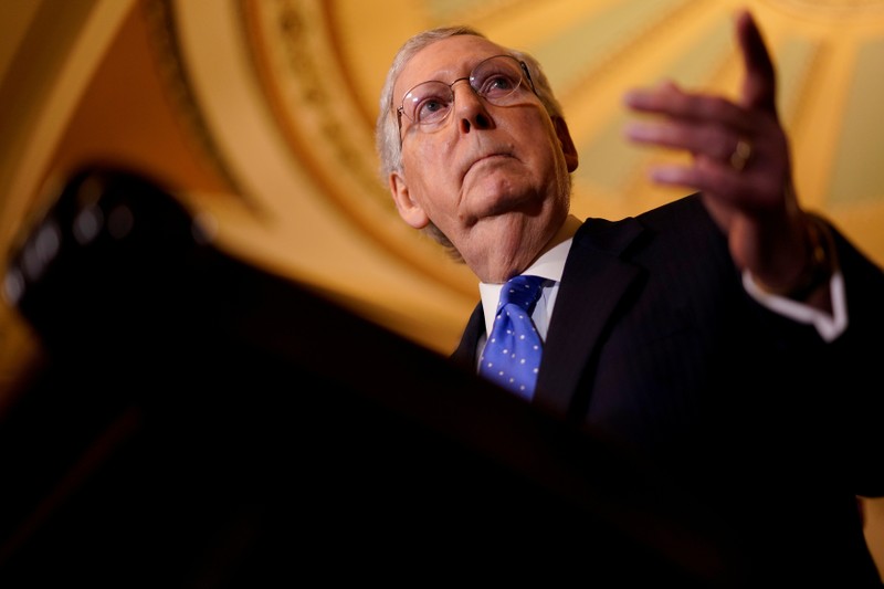 FILE PHOTO - Senate Majority Leader Mitch McConnell speaks with reporters following the weekly policy luncheons on Capitol Hill
