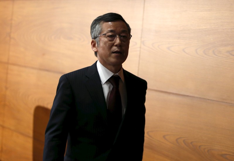 Newly-appointed Bank of Japan board member Harada leaves a news conference at the BOJ headquarters in Tokyo