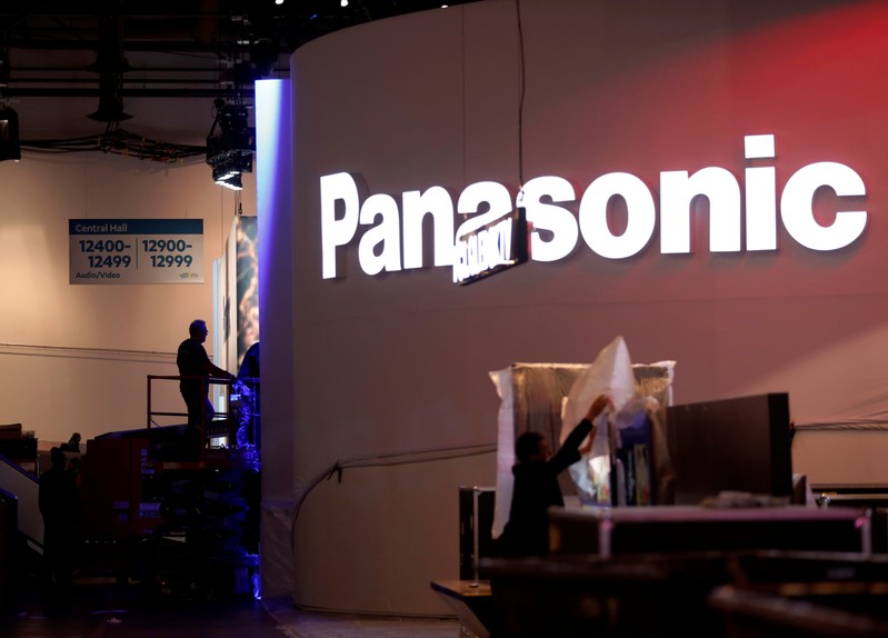 FILE PHOTO: Workers set up a Panasonic booth at the Las Vegas Convention Center in preparation for 2019 CES in Las Vegas