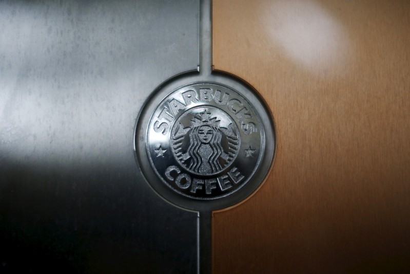 A Starbucks logo is seen on an espresso machine in a store inside the Tom Bradley terminal at LAX airport in Los Angeles
