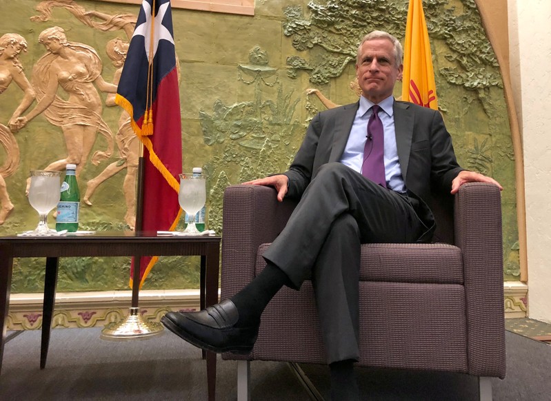 FILE PHOTO: Dallas Federal Reserve Bank President Robert Kaplan poses at a luncheon in El Paso