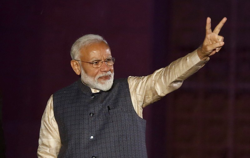 Indian Prime Minister Narendra Modi gestures towards his supporters after the election results at Bharatiya Janata Party (BJP) headquarter in New Delhi