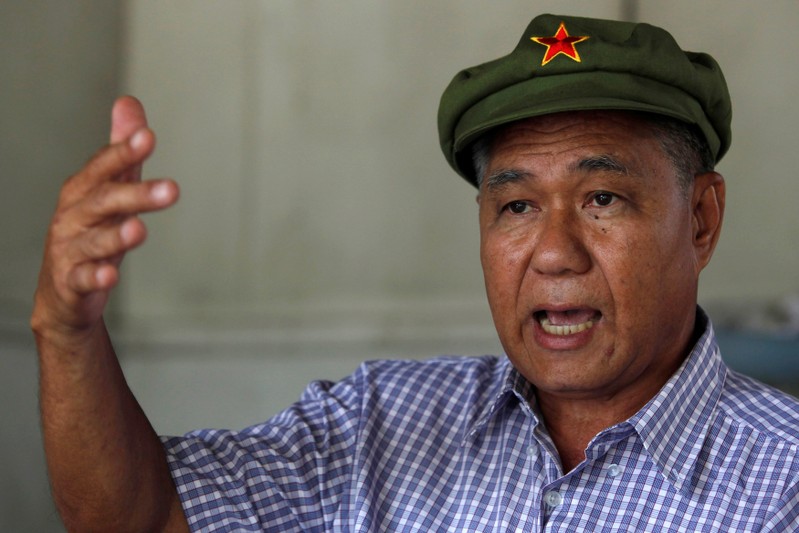 FILE PHOTO: Former communist and political prisoner Surachai Danwattananusorn gestures during an interview at his home in Bangkok
