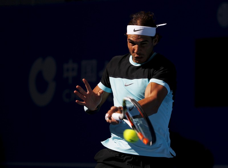 Rafa Nadal of Spain hits a return against Fabio Fognini of Italy during their men's singles semifinal match at the China Open tennis tournament in Beijing