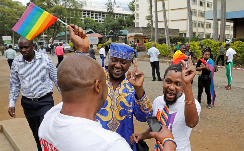LGBT activists gather for the ruling on whether to uphold or nullify law banning gay sex, outside the Milimani high Court in Nairobi