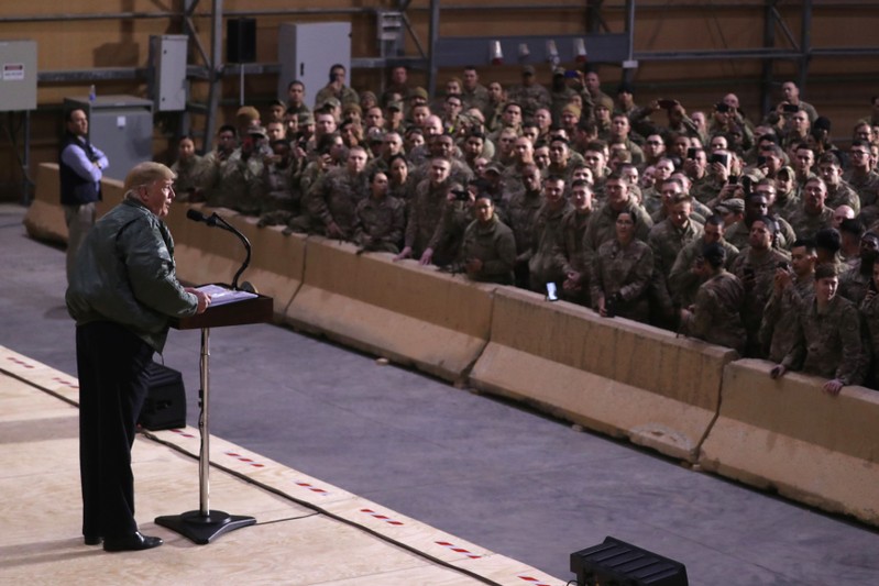 U.S. President Trump delivers remarks to U.S. troops in an unannounced visit to Al Asad Air Base, Iraq