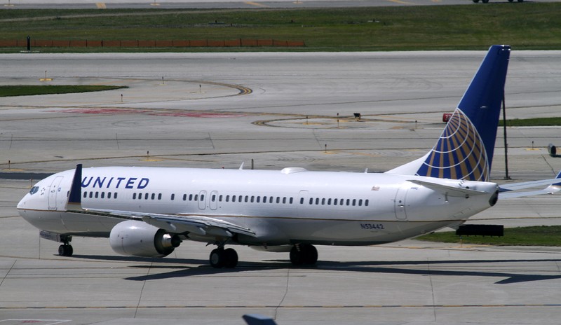 FILE PHOTO: A United Airlines plane with the Continental Airlines logo on its tail, taxis to the runway at O'Hare International airport in Chicago