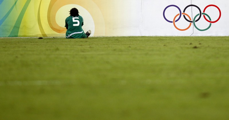 Nigeria's Onome Ebi sits on the pitch during their women's first-round group F soccer match against Brazil at the Beijing 2008 Olympic Games