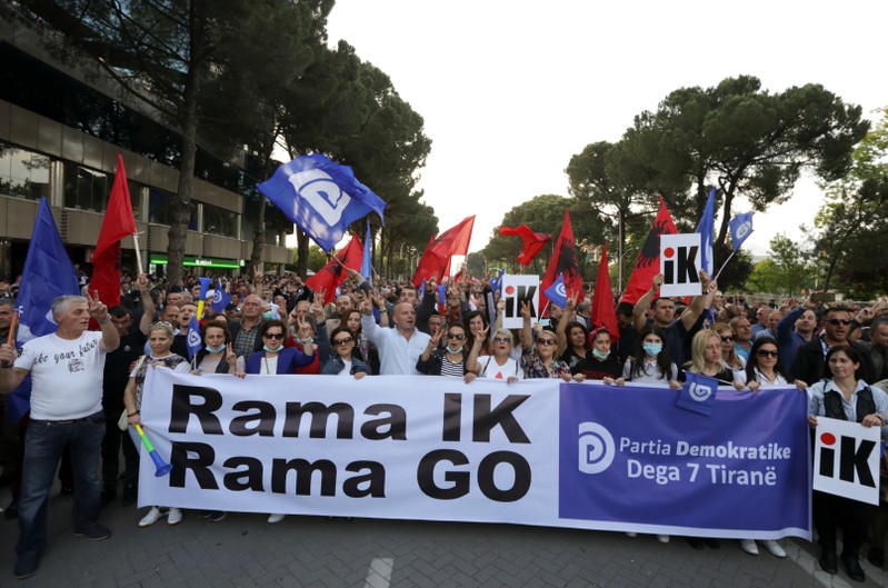 Supporters of the opposition party attend an anti-government protest in Tirana