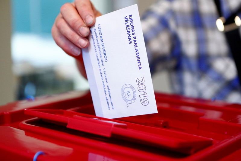 A man casts his vote during European Parliament election in Riga