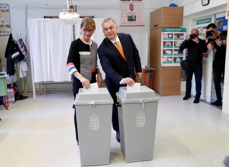 Hungarian Prime Minister Viktor Orban and his wife Aniko Levai cast their ballots during the European Parliament Elections in Budapest