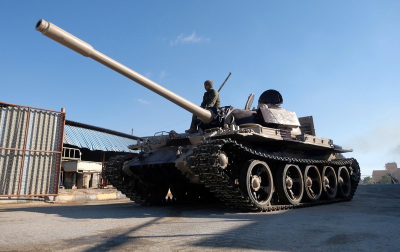 Members of Libyan National Army (LNA) commanded by Khalifa Haftar, get ready before heading out of Benghazi to reinforce the troops advancing to Tripoli, in Benghazi