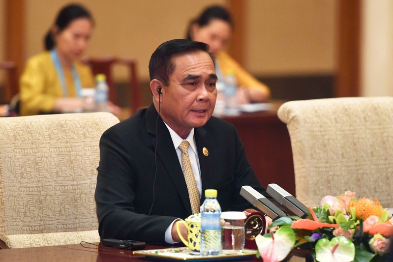 Thailand's Prime Minister Prayuth Chan-ocha speaks to Chinese Premier Li Keqiang during their meeting at the Diaoyutai State Guesthouse in Beijing