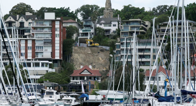 An earth mover prepares the foundation of new apartment block development in the waterfront suburb of Rushcutters Bay
