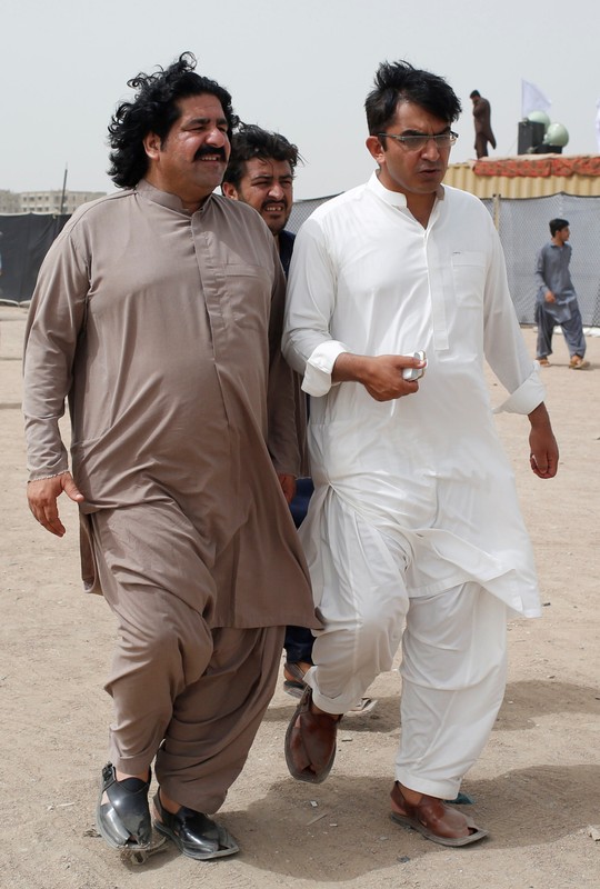 FILE PHOTO: Ali Wazir and Mohsin Dawar PTM leaders walk at the venue of the rally in Karachi