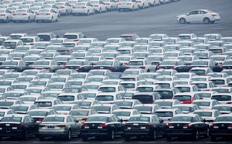 FILE PHOTO: Newly manufactured cars are seen at the automobile terminal in the port of Dalian