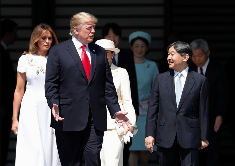 U.S. President Donald Trump and first lady Melania Trump are escorted by Japan's Emperor Naruhito and Empress Masako during an welcome ceremony at the Imperial Palace in Tokyo