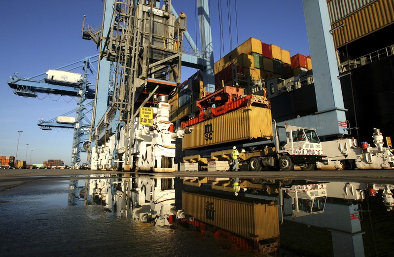 FILE PHOTO: Crews load and unload consumer products at the Port of New Orleans along the Mississippi River in New Orleans, Louisiana