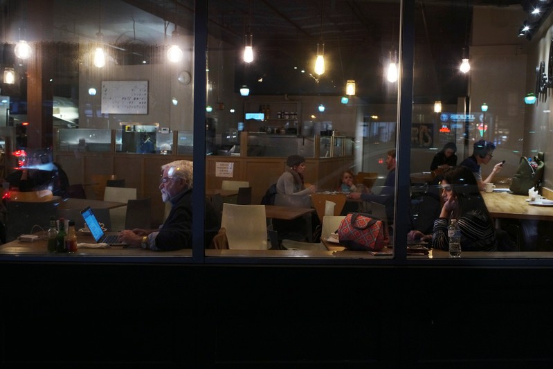Customers sit in a crepe restaurant in Somerville