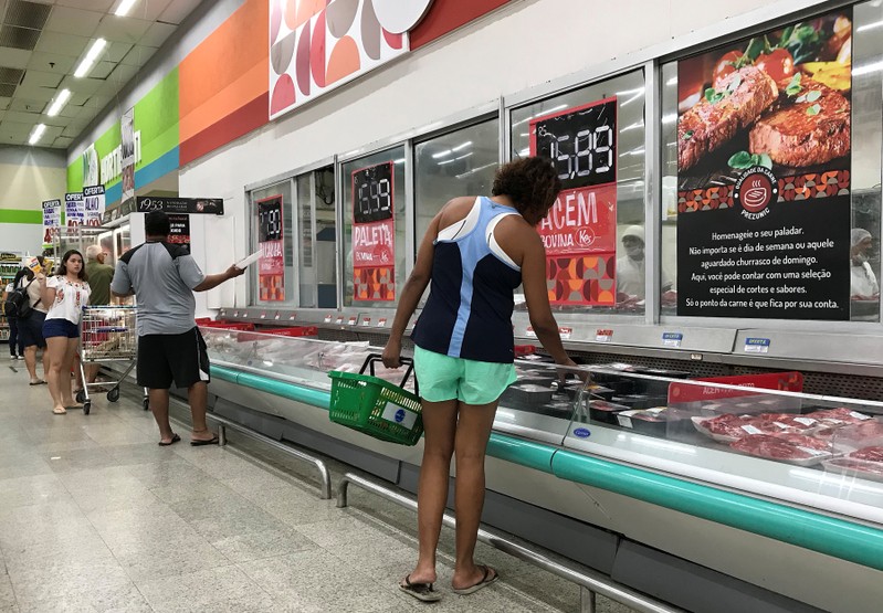 Customers shop at a supermarket in Rio de Janeiro