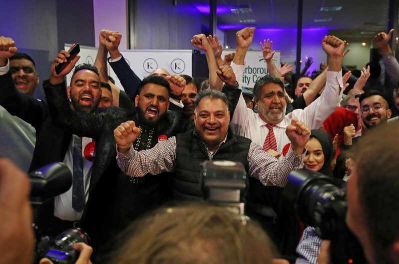 Labour Party activists and supporters react after Labour Party candidate Lisa Forbes wins the Peterborough by-election at the KingsGate Centre in Peterborough