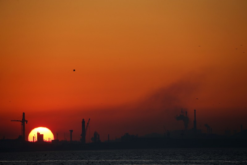 Dunkirk port industries are seen during sunset, in Leffrinckouke