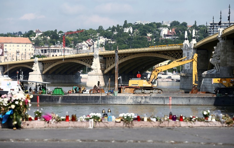 A dredge is seen near a tourist boat accident site in the Danube river in Budapest