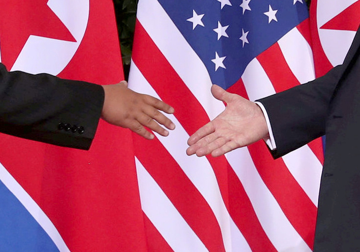 FILE PHOTO: U.S. President Donald Trump shakes hands with North Korean leader Kim Jong Un at the Capella Hotel on Sentosa island in Singapore