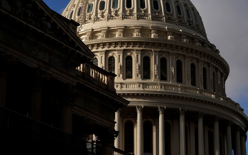 FILE PHOTO: Sun shines on the U.S. Capitol Dome as budget legislation deadlines loom for a potential federal government shutdown in Washington