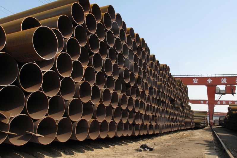 Steel pipes waiting to be loaded and transferred to the port are seen at a steel mill in Cangzhou