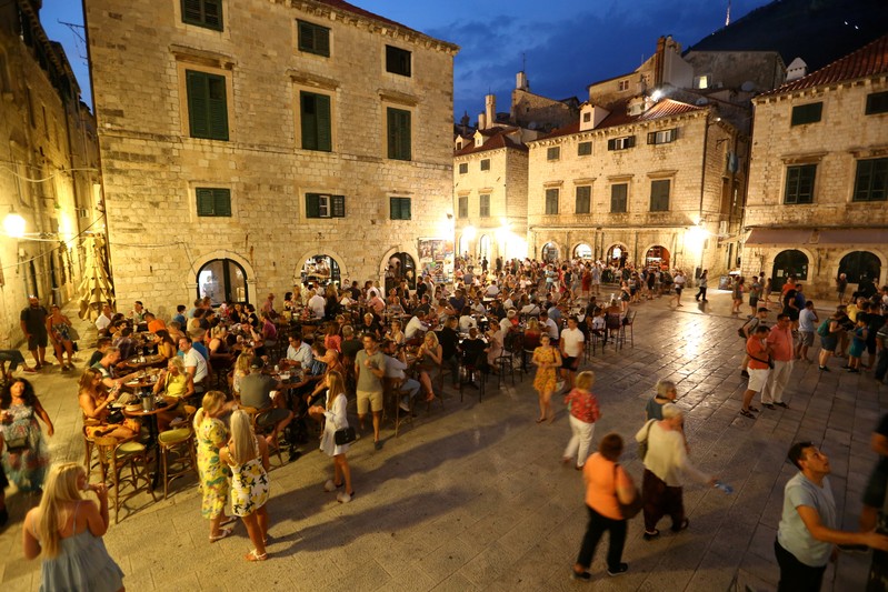 FILE PHOTO: People are seen in a coffee shop in Dubrovnik